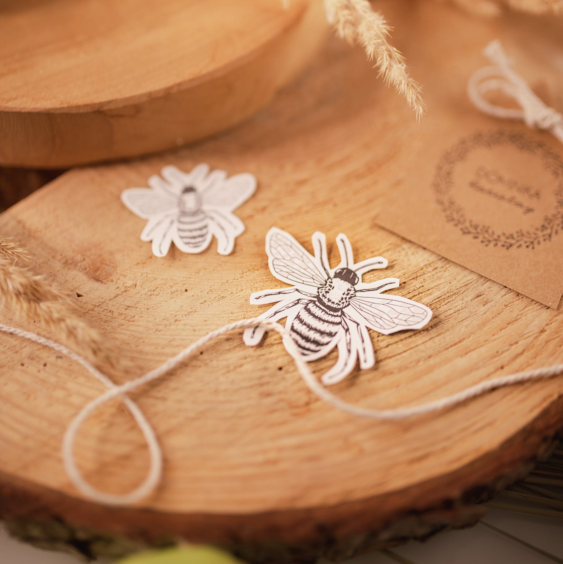 Threads and applique work ornaments on wooden board